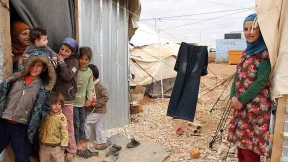 Children in the Zaâatri refugee camp play outside their newly installed winterized shelter. Â© A. G. Riisnes/NCA