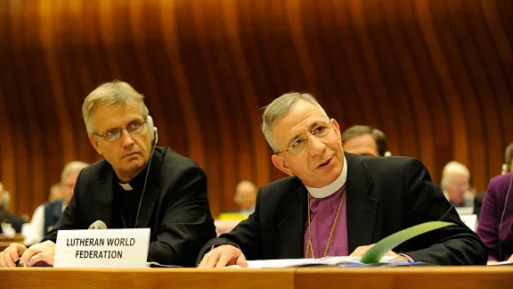 LWF President Bishop Dr Munib A. Younan (right) addressing the UNHCR Dialogue meeting with faith leaders, on the left is LWF General Secretary Rev. Martin Junge. Â© LWF/Peter Williams