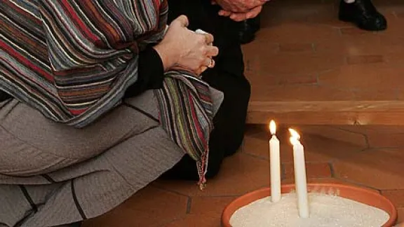 Participants light candles during morning prayer at a past LWF consultation on theology in the life of Lutheran churches. Â© LWF/D.-M. GrÃ¶tzsch