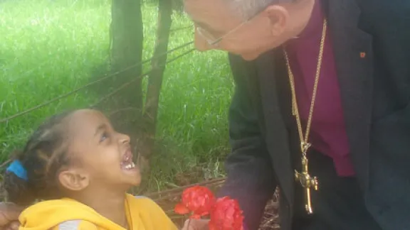 LWF President Bishop Dr Munib A. Younan is welcomed by a little girl at the EECMY-run center for children with mental disabilities. Â© LWF/Shibru Galla