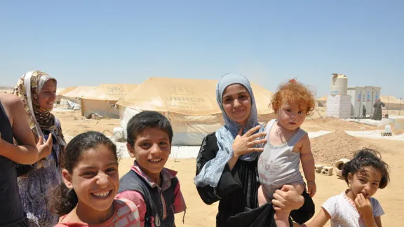 A number of young refugees, including a child with Down syndrome, at Za'atri camp. LWF assistance is prioritizing children with special needs as well as adults with disabilites. Â© LWF/DWS/R. Schlott