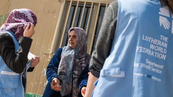 LWF humanitarian workers assist a woman in the Middle East. Photo: Christian Jepsen