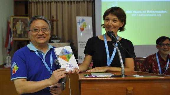 Anne Burghart, Secretary for Ecumenical Relations, with the Chinese translation of the Reformation Booklets. 