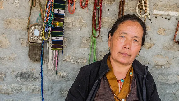 Tibetan refugee Kunsang Dolma sells jewelry made through LWF-training support for women groups. Photo: LWF/Christopher Waddell