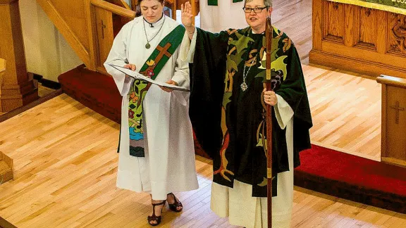 ELCIC National Bishop Susan Johnson (right), with Diaconal Minister Virginia Burke, at the convention closing worship service. Photo: ELCIC