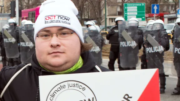 LWF COP 24 delegate Mr Wylie Cook, takes part in a march during the 2018 UN climate conference in Katowice, Poland. Photo: LWF/Sean Hawkey