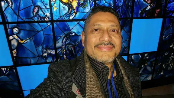 The people that walked in darkness have seen a great light: Larry Madrigal stands in front of the stained glass mural that inspired his mother at the 1994 CSW. Photo: L Madrigal