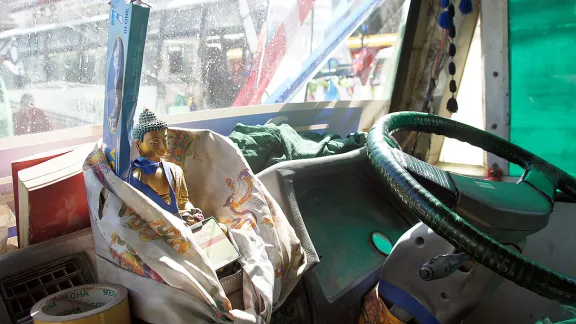 Buddha on the dashboard in a Nepali bus. Photo: LWF/ C. KÃ¤stner