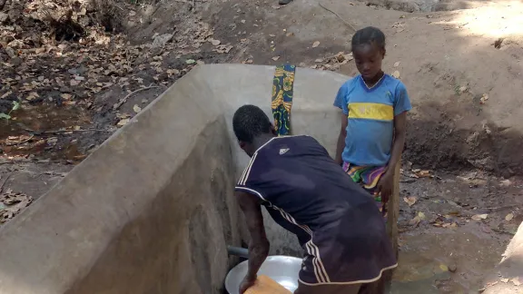 Drawing water from a source that was recently rehabilitated by the LWF in Nana MambÃ©rÃ©, Central African Republic. Photo: LWF/CAR