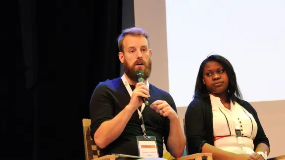 Jeff Buhse and Tsiry Rakoto, of the LWF climate justice working group, tell young Lutherans in Wittenbergy that they need to support political commitment to a reasonable climate change agreement at the COP21 conference in Paris later this year. Photo: GNC/LWF/F. HÃ¼bner