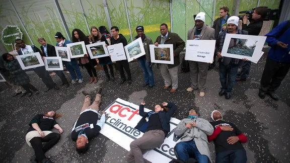 LWF partner ACT Alliance action on loss and damage, on the main concourse of the UN climate talks COP21 being held in Paris. Â© Sean Hawkey/WCC 