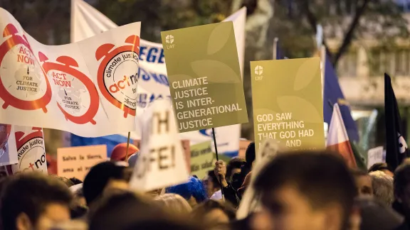 Faith-based participants from the Lutheran World Federation, the World Council of Churches and the ACT Alliance join in as thousands of people march through the streets of central Madrid, Spain, as part of a public contribution to the United Nations climate meeting COP25, urging decision-makers to act for climate justice. Photo: LWF/Albin Hillert