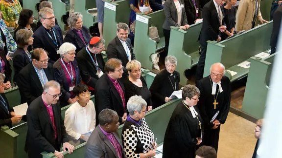 Bishop Gerhard Ulrich, chairperson of LWF German National Committee and Bishop Ilse Junkermann of the Evangelical Church in Central Germany enter the Town Church in Wittenberg for opening worship service. LWF/Felix Kalbe