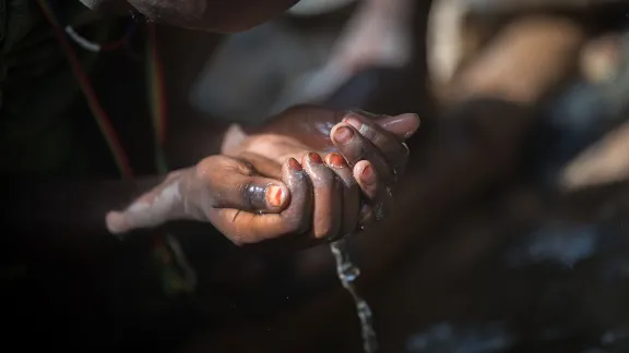 At the river nearby the Burka Dare site for Internally Displaced People in Oromia, Ethiopia. The Lutheran World Federation supports internally displaced people in several regions of Ethiopia, through water, sanitation and hygiene (WASH). Photo: LWF/Albin Hillert