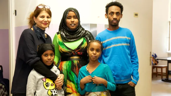 Refugee family with caretaker, left, at the refugee home Rossauer LÃ¤nde, Austria. Photo: Diakonie Refugee Service Austria/ Nadja Meister