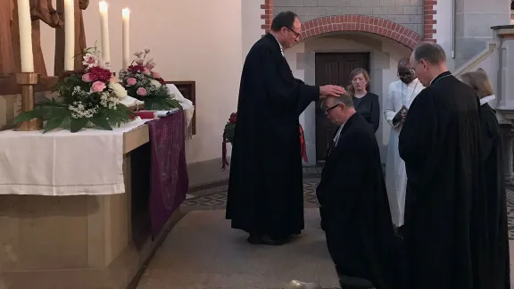 WÃ¼rttemberg Bishop Dr Frank O. July is installed as the new chairperson of the German National Committee, in Hanover, Germany. Photo: GNC