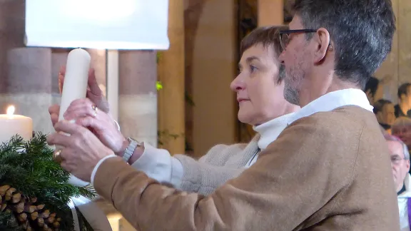 Married couple Catherine and Dominique Keller â he Catholic and she Lutheran â light the fourth candle marking the ecumenical imperatives. Photo: DiocÃ¨se de Strasbourg/Marc Larchet