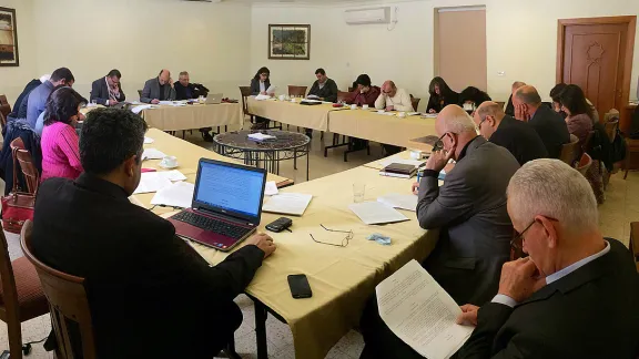 The ELCJHL Synod looks over the revised constitution for its Ecclesiastical Court before it was put to a vote. Photo: D. Hudson/ELCJHL