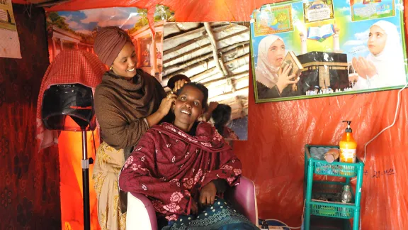 Suhai Ismael Abuker with a customer in her hairdressing salon. Photos: LWF/C. KÃ¤stner