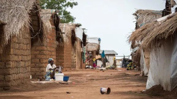 A woman does her dishes in the Borgop refugee camp, Cameroon. The camp currently holds 12,300 refugees from the Central African Republic. Photo: LWF/Albin Hillert