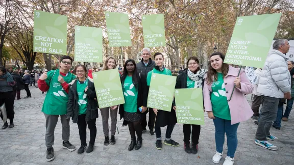 LWF delegates to COP25 taking place in Madrid, Spain, in 2019 preparing to join a march through the streets of central Madrid as part of a public contribution to the United Nations climate meeting, urging decision-makers to take action for climate justice. Photo: LWF/Albin Hillert