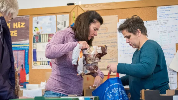 Volunteer workers in Budapest prepare boxes of food and other necessities for Ukrainian refugees at MandÃ¡k House, home to the Evangelical Lutheran Church in Hungary. Photo: LWF/A. Hillert