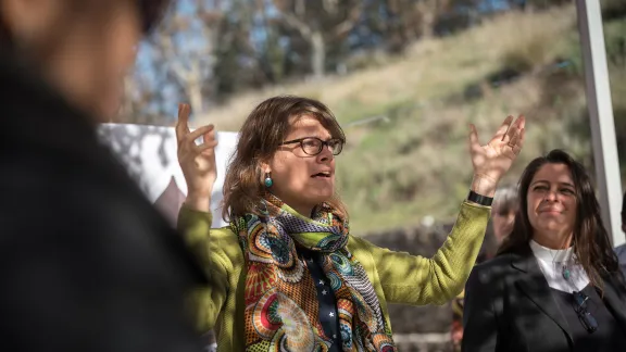 Arianne van Andel from the Interreligious Aliance for the Climate, Chile leads a word of prayer, as people of faith gather in a 'Prayer for the Rainforest' as part of the Cumbre Social por el Clima, on the fringes of COP25 in Madrid. Photo: LWF/Albin Hillert