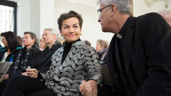 Christiana Figueres, Executive Secretary of the United Nations Framework Convention on Climate Change (UNFCCC), greets LWF Secretary General Martin Junge before a ceremony for the presentation of some 1.8 million signatures on an interfaith petition for climate justice during the COP21 climate summit in Paris, France, November 28, 2015. Photo: LWF/Ryan Rodrick Beiler