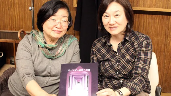 JELC member Ms Kyoko Tawara [left] and Ms Kiyoe Narita from JLC, displaying the LWF Gender Justice Policy in Japanese, at the April 2015 WICAS meeting in Tokyo, Japan. Photo: LWF/WICAS