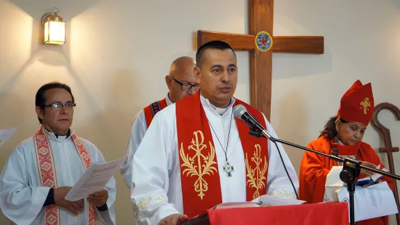 Rev Rolando Antonio Ortez, Pastor President of the ICLH, presides at the ordinations of three male and four female pastors in 2017. Photo: LWF/P. Cuyatti