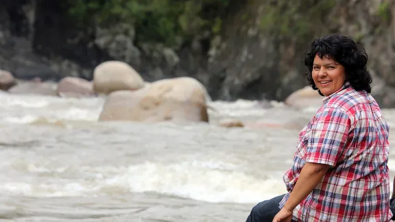 Berta Caceres stands at the Gualcarque River in the Rio Blanco region of western Honduras where she, COPINH (the Council of Popular and Indigenous Organizations of Honduras) and the people of Rio Blanco have maintained a two year struggle to halt construction on the Agua Zarca Hydroelectric project, that poses grave threats to local environment, river and indigenous Lenca people from the region. Photo: Tim Russo/Goldman Environmental Prize