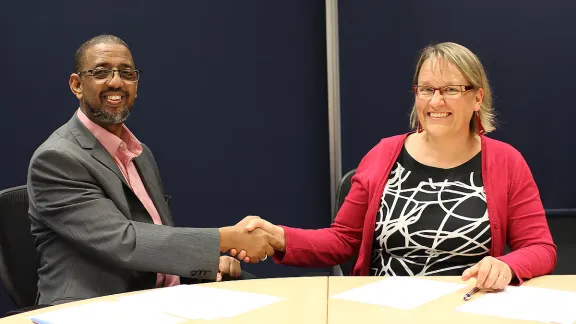 Naser Haghamed, Chief Executive Officer, Islamic Relief Worldwide and Maria Immonen, World Service Director, The Lutheran World Federation shake hands after renewing the Memorandum of Understanding. Photo: Islamic Relief Worldwide