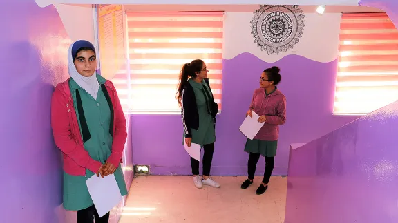 Colorful paint and student art line the hallway.jpg Caption: Proud students in the hallway of the newly renovated school. Photo: LWF/ E.Massell