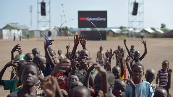 Children hold up an antenna to better receive the TEDx broadcast in Kakuma refugee camp. All photos: TEDx