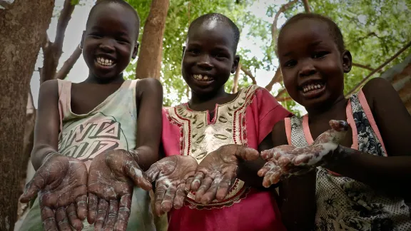 From left to right, 9-year-old Freedom Gai, 7-year-oldÂ NyalatÂ Pouch and 5-year-oldÂ NyabenaÂ GaiÂ show how proper hand washing with soap can prevent the spread of the COVID-19 virus.Â AllÂ Photos:Â LWF/P.Â Kwamboka