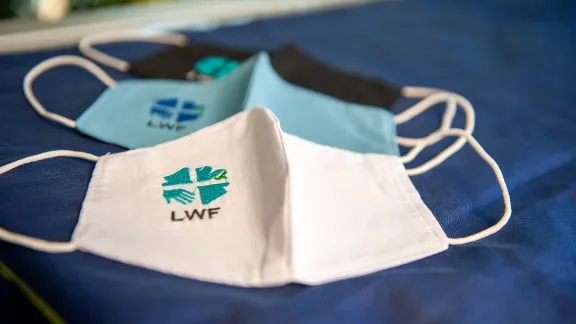 Wear it, share it. LWF embroidered protective face masks. Photo: LWF/S. Gallay 