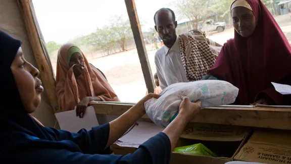 New arrivals at the Ifo refugee camp receive an LWR baby kit as well as other non-food items as they are formally registered during the reception process in Dadaab, Kenya. The Ifo settlement is the oldest of the camps in Dadaab, dating back to the early 1990s. Photo: Jonathan Ernst/LWR (2011)