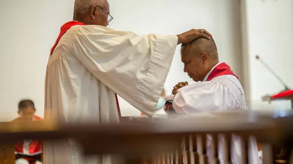 Malagasy Lutheran Church President Rev. Dr Denis Rakotozafy (kneeling) was installed during Sunday worship in Antananarivo, Madagascar. Photo: MLC