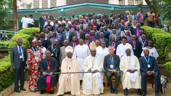 Tanzanian and global Lutheran church leaders gather with other heads of churches in Africa outside the Moshi Town Cathedral. Photo: LWF/Allison Westerhoff 