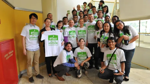 LWF President, Bishop Munib Younan, General Secretary, Rev. Dr Martin Junge and young council members advocate for climate justice. Photo: LWF/Sean Hawkey