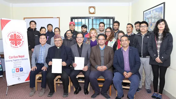 LWF representatives and Caritas Nepal team after signing the MoU in the Caritas Nepal office. Photo: LWF