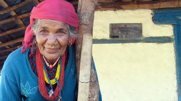 Kali Kamini, known as âgrandmaâ to the village, in front of her new house. Photo: LWF/ U. Pokharel