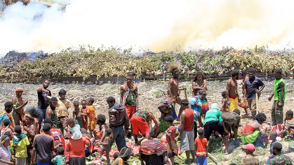 Burning the stone, originally a traditional Papuan way of cooking and also a thanksgiving ceremony, sometimes also the scene for harmful traditional practices. Photo: John Roy Purba/HKBP