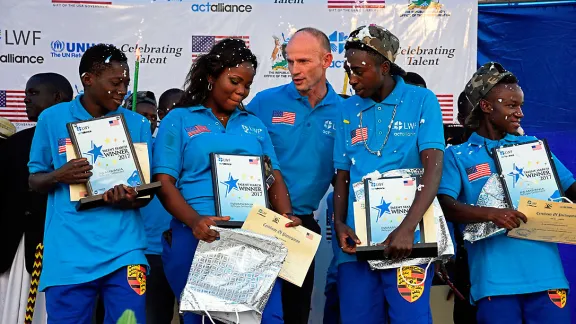 Jesse Kamstra, LWF country representative in Uganda (center), with the winners of the contest. Photos: LWF/ S. Nalubega