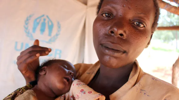 Hatungaimana Justina gave brith to baby Furaha Eliza just days after fleeing her native Burundi. She and her family made it to the safey of the Mtendeli camp where LWF partner, Tanganyika Christian Refugee Service drills boreholes that supply water to the camp. Photo: LWF/S.Cox