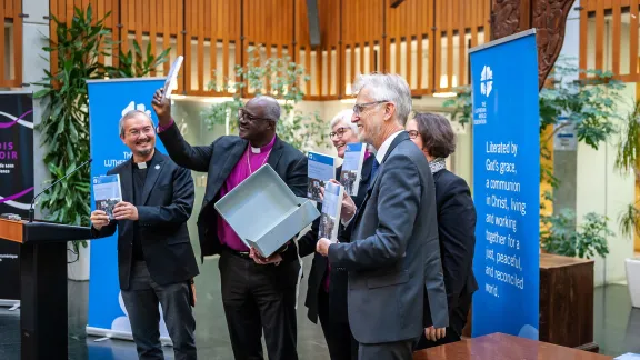 Unveiling the book. Left to right: Rev. Dr Sivin Kit, Archbishop Dr Panti Filibus Musa, Archbishop Dr Antje JackelÃ©n, Rev. Dr Martin Junge, and Rev. Dr Simone Sinn. Photo: LWF