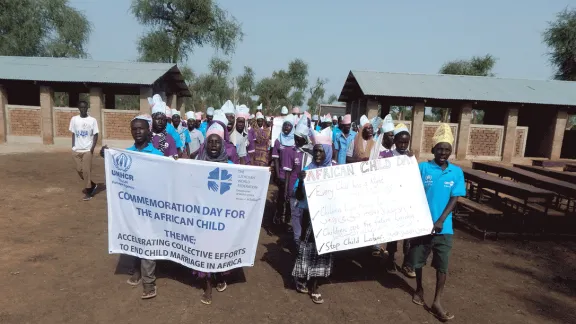 Dozens of school children march into Blue Nile Primary School protesting child marriage. Photo: LWF/J. Tiboa