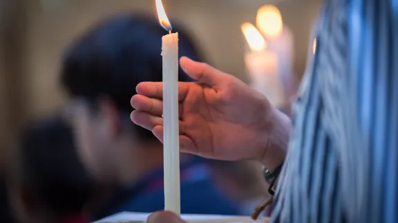 Candle lighting during a church service. Photo: LWF/Albin Hillert