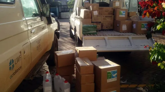 Personal protective equipment and hygiene items being loaded for delivery to LWF staff in refugee settlements in Uganda. All photos: LWF Uganda