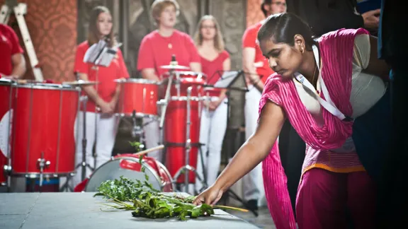 During opening worship in the Castle Church, young reformers were invited to bring to the altar symbolic gifts from their respective regions. Photo: LWF/Marko Schoeneberg